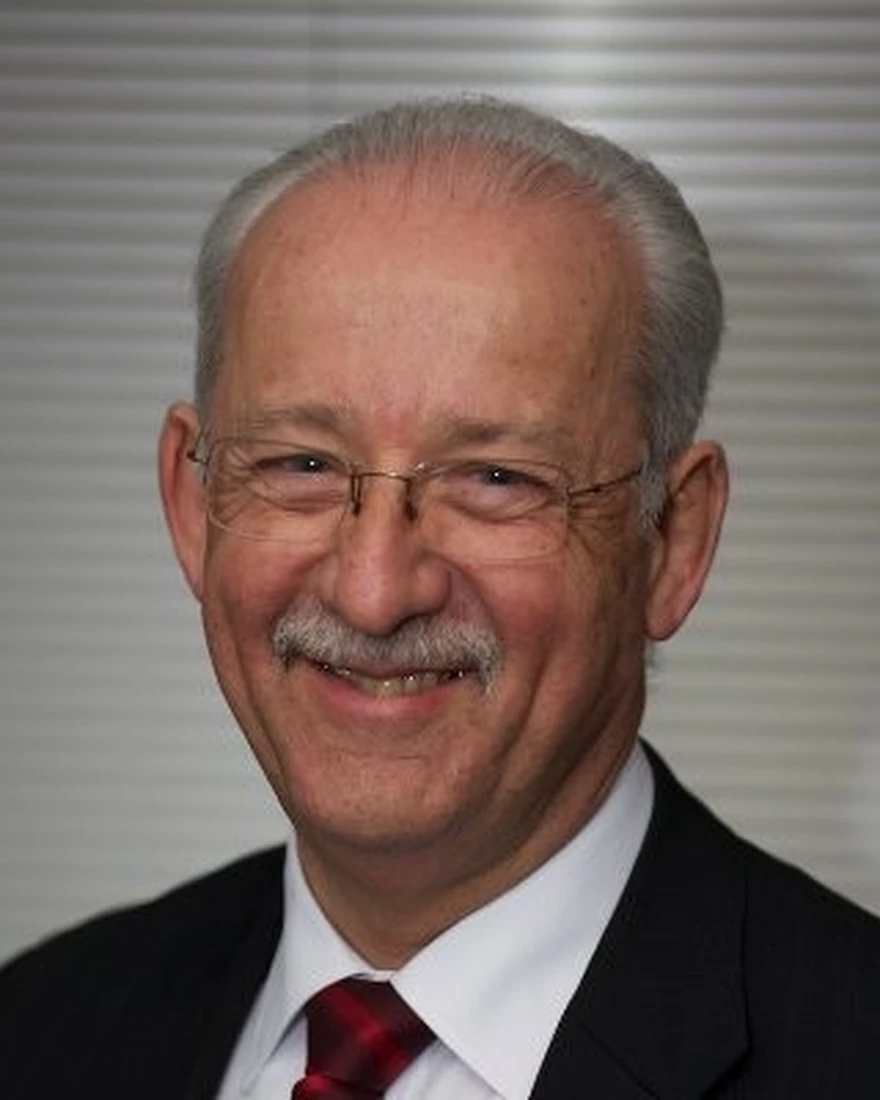A smiling Steve Sutherland-Tomey, an instructional designer and resource writer, poses for a professional headshot.